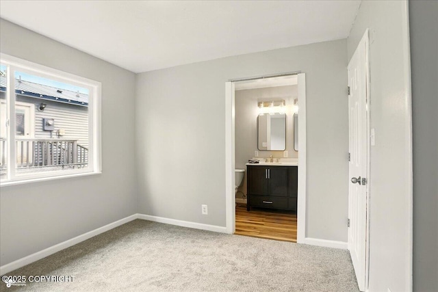 3624 E 16th Ave, Anchorage, AK 99508 - unfurnished bedroom with carpet, baseboards, and a sink