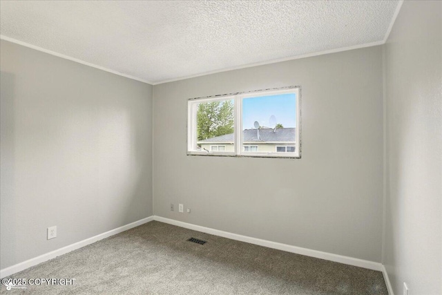 3624 E 16th Ave, Anchorage, AK 99508 - spare room with carpet flooring, baseboards, crown molding, and a textured ceiling