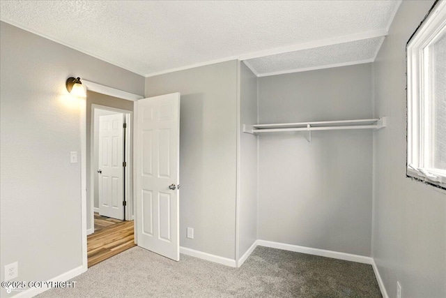 3624 E 16th Ave, Anchorage, AK 99508 - unfurnished bedroom featuring carpet, a textured ceiling, baseboards, and a closet
