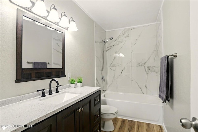 3624 E 16th Ave, Anchorage, AK 99508 - full bathroom with vanity, toilet, washtub / shower combination, and wood finished floors