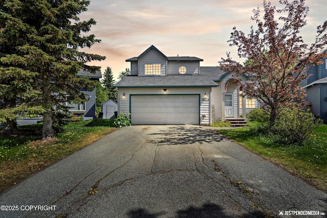 10321 Compass Cir, Anchorage, AK 99515 - traditional-style house with asphalt driveway and a shed