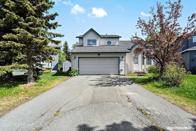 10321 Compass Cir, Anchorage, AK 99515 - traditional-style home featuring asphalt driveway and a garage