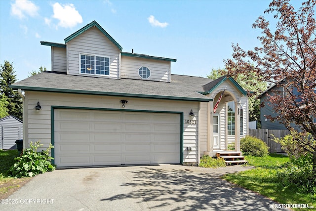 10321 Compass Cir, Anchorage, AK 99515 - view of front of property with asphalt driveway and a garage