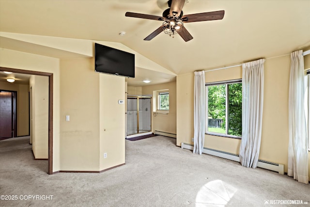 10321 Compass Cir, Anchorage, AK 99515 - unfurnished living room with a baseboard heating unit, carpet, lofted ceiling, baseboards, and a ceiling fan
