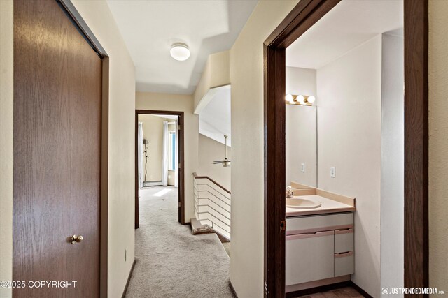 10321 Compass Cir, Anchorage, AK 99515 - corridor featuring carpet and a sink