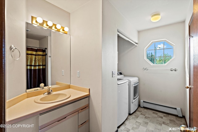 10321 Compass Cir, Anchorage, AK 99515 - washroom featuring baseboard heating and independent washer and dryer