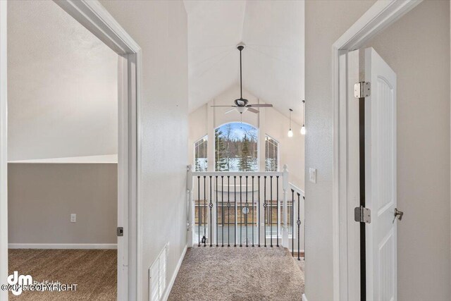 53578 Bell Ave, Nikiski/North Kenai, AK 99611 - hallway featuring carpet floors and vaulted ceiling