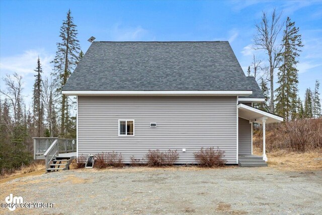 53578 Bell Ave, Nikiski/North Kenai, AK 99611 - view of side of home featuring roof with shingles