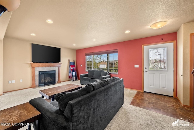 241 N Pasture Pl, Palmer, AK 99645 - living area featuring carpet floors, a fireplace with flush hearth, a textured ceiling, recessed lighting, and baseboards