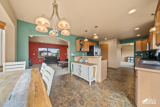 241 N Pasture Pl, Palmer, AK 99645 - kitchen featuring stainless steel appliances, stone tile flooring, arched walkways, open shelves, and recessed lighting