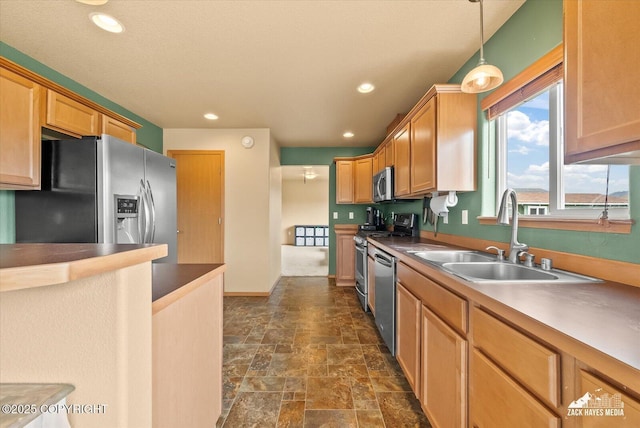 241 N Pasture Pl, Palmer, AK 99645 - kitchen with appliances with stainless steel finishes, a sink, dark stone finish flooring, recessed lighting, and decorative light fixtures