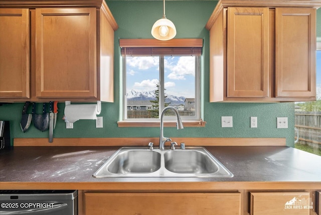 241 N Pasture Pl, Palmer, AK 99645 - kitchen featuring a sink, stainless steel dishwasher, dark countertops, and pendant lighting