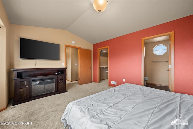 241 N Pasture Pl, Palmer, AK 99645 - carpeted bedroom with lofted ceiling, ensuite bath, a spacious closet, and a closet