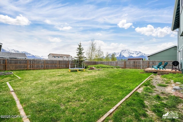 241 N Pasture Pl, Palmer, AK 99645 - view of yard featuring a trampoline and a deck with mountain view