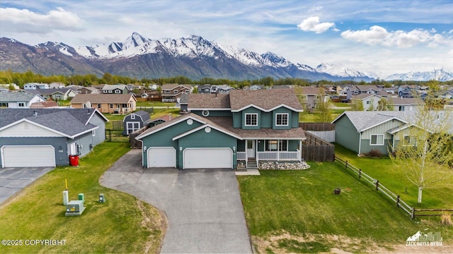 241 N Pasture Pl, Palmer, AK 99645 - traditional home featuring a residential view, driveway, a mountain view, and covered porch