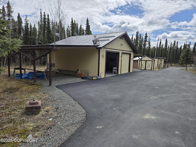 35515 King Salmon Ave, Soldotna, AK 99669 - garage with a detached garage and a storage unit