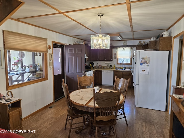 35515 King Salmon Ave, Soldotna, AK 99669 - dining space with a chandelier, dark wood-style flooring, and baseboards