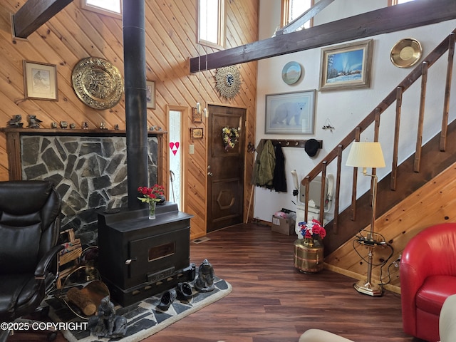 35515 King Salmon Ave, Soldotna, AK 99669 - living room with a wood stove, wooden walls, high vaulted ceiling, stairs, and wood finished floors