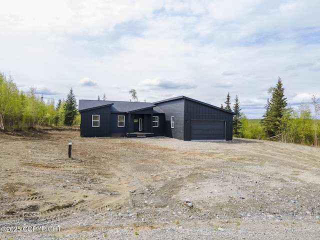 1866 S Rolling Hills St, Wasilla, AK 99623 - view of outdoor structure featuring a garage and dirt driveway