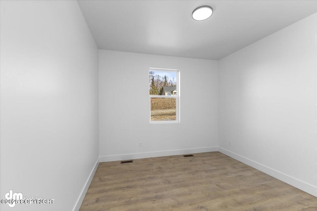 1866 S Rolling Hills St, Wasilla, AK 99623 - unfurnished room featuring baseboards and wood finished floors