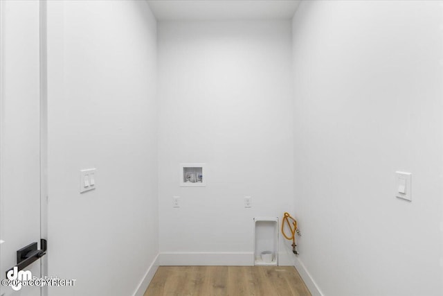 1866 S Rolling Hills St, Wasilla, AK 99623 - laundry area featuring light wood-type flooring, hookup for a washing machine, and baseboards