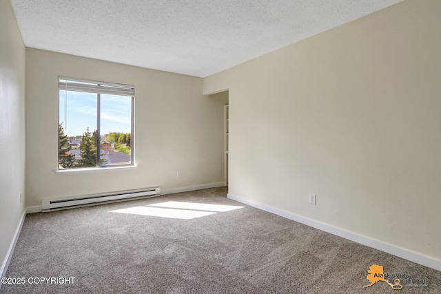 4640 Reka Dr Unit 19, Anchorage, AK 99508 - spare room with baseboard heating, carpet flooring, baseboards, and a textured ceiling