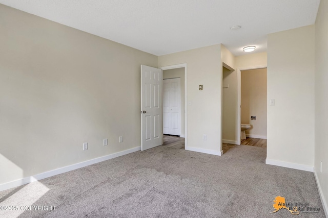 4640 Reka Dr Unit 19, Anchorage, AK 99508 - unfurnished bedroom featuring carpet flooring and baseboards