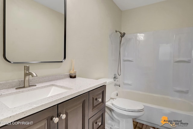 4640 Reka Dr Unit 19, Anchorage, AK 99508 - bathroom featuring vanity, toilet, and bathtub / shower combination