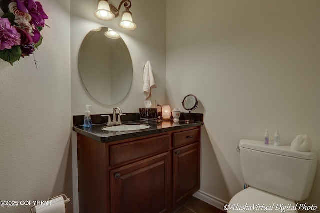 10885 Splendor Loop, Eagle River, AK 99577 - half bathroom with vanity, toilet, and tile patterned floors