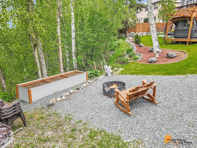 10885 Splendor Loop, Eagle River, AK 99577 - view of yard featuring a fire pit