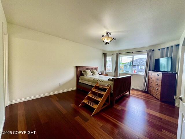 10885 Splendor Loop, Eagle River, AK 99577 - bedroom with wood finished floors and baseboards