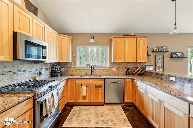 37638 Dutch Landing Loop, Sterling, AK 99672 - kitchen featuring stainless steel appliances, a sink, light brown cabinets, decorative backsplash, and lofted ceiling