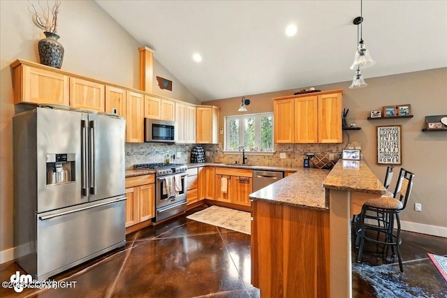 37638 Dutch Landing Loop, Sterling, AK 99672 - kitchen with stainless steel appliances, a peninsula, backsplash, finished concrete flooring, and recessed lighting