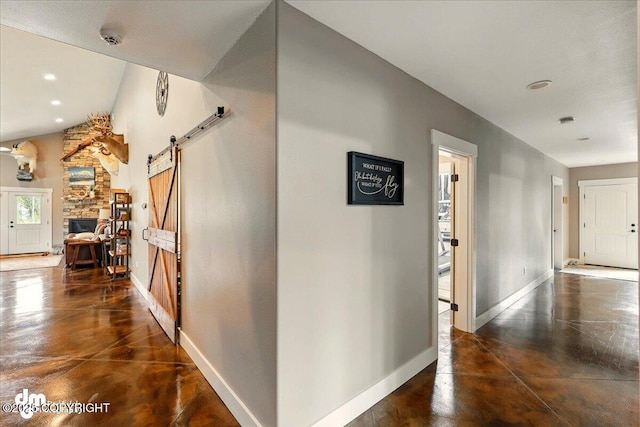 37638 Dutch Landing Loop, Sterling, AK 99672 - corridor with finished concrete floors, a barn door, baseboards, and recessed lighting