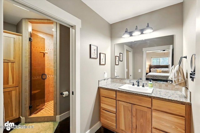 37638 Dutch Landing Loop, Sterling, AK 99672 - ensuite bathroom featuring a shower stall, vanity, and baseboards