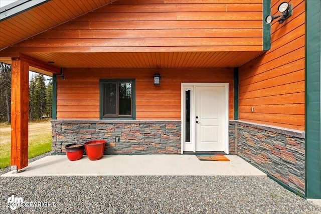 37638 Dutch Landing Loop, Sterling, AK 99672 - view of exterior entry featuring stone siding and covered porch