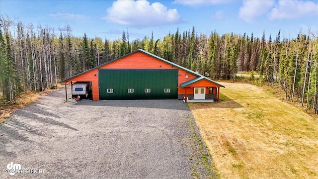 37638 Dutch Landing Loop, Sterling, AK 99672 - view of home's exterior featuring a wooded view and a garage