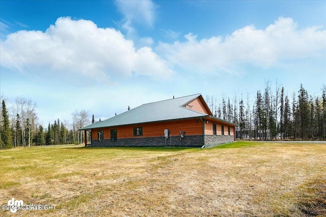 37638 Dutch Landing Loop, Sterling, AK 99672 - view of property exterior featuring stone siding and a yard