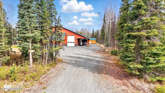 37638 Dutch Landing Loop, Sterling, AK 99672 - view of front of property with dirt driveway, a garage, and an outdoor structure