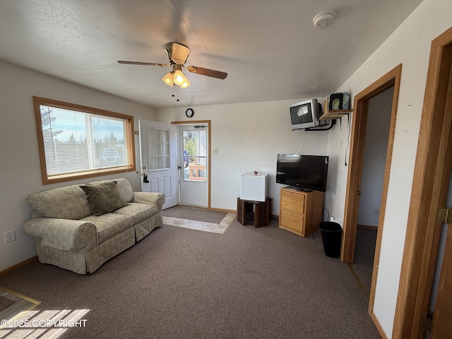 69290 Emily Ct, Ninilchik, AK 99556 - living room featuring a ceiling fan, light carpet, and baseboards