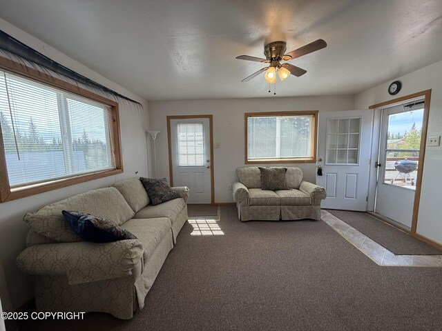 69290 Emily Ct, Ninilchik, AK 99556 - living area with light colored carpet, ceiling fan, and baseboards