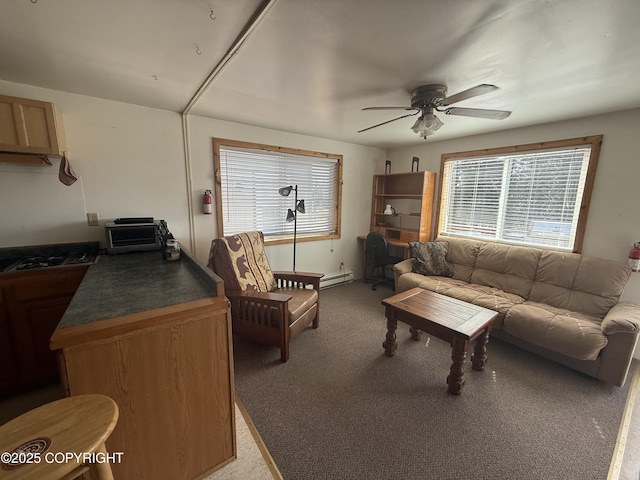 69290 Emily Ct, Ninilchik, AK 99556 - living room featuring carpet flooring, a ceiling fan, and baseboard heating