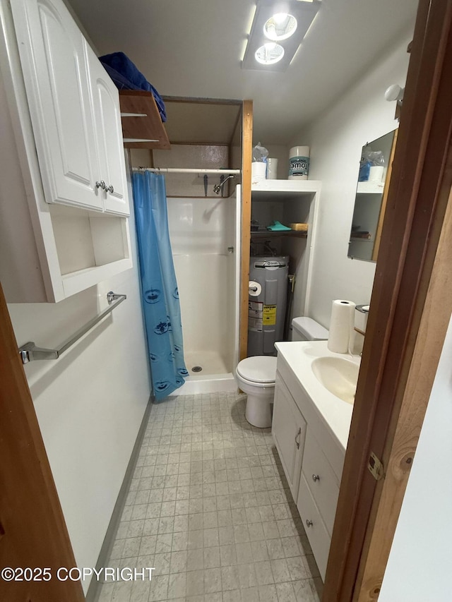 69290 Emily Ct, Ninilchik, AK 99556 - full bath with electric water heater, a shower stall, vanity, and toilet