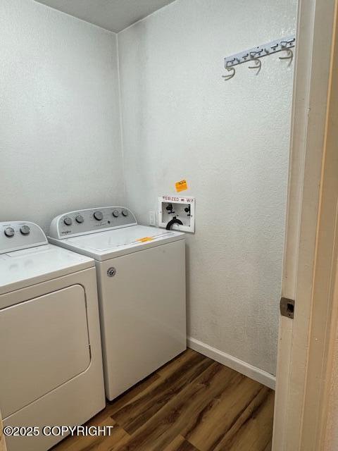 180 Grand Larry St Unit B6, Anchorage, AK 99504 - laundry area with washing machine and clothes dryer, dark wood-style flooring, and baseboards