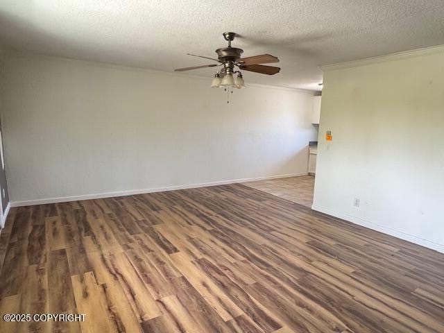 180 Grand Larry St Unit B6, Anchorage, AK 99504 - unfurnished room featuring ceiling fan, wood finished floors, a textured ceiling, ornamental molding, and baseboards