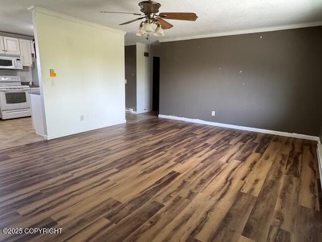 180 Grand Larry St Unit B6, Anchorage, AK 99504 - unfurnished living room with crown molding, a ceiling fan, wood finished floors, and baseboards
