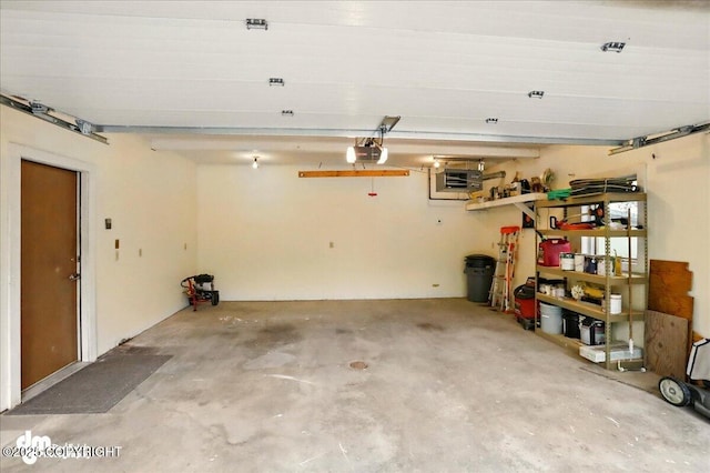19254 Adak Cir, Eagle River, AK 99577 - garage featuring a garage door opener