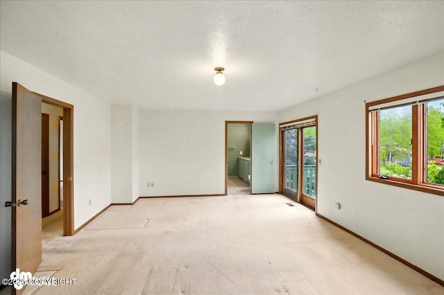 19254 Adak Cir, Eagle River, AK 99577 - spare room featuring light colored carpet and baseboards