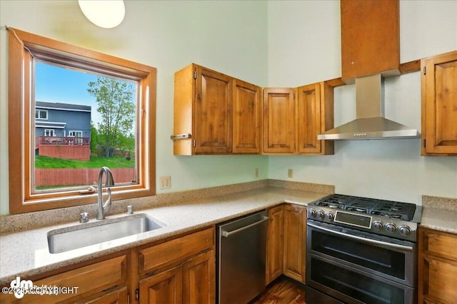 19254 Adak Cir, Eagle River, AK 99577 - kitchen with stainless steel appliances, wall chimney range hood, a sink, and light countertops