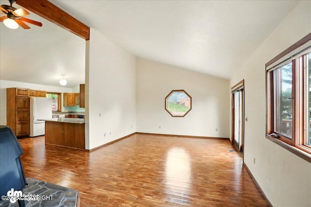 19254 Adak Cir, Eagle River, AK 99577 - unfurnished living room featuring wood finished floors, ceiling fan, beamed ceiling, high vaulted ceiling, and baseboards